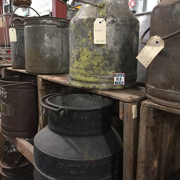 Vintage and antique cream and milk cans for sale at Heaths Old Wares, collectables and industrial antiques- 19-21 Broadway, Burringbar NSW 2483. Open 7 days 9am - 5pm. Ph: 02 6677 1181